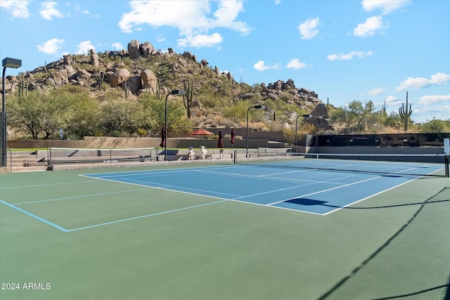 view of tennis court with basketball court