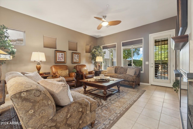 tiled living room featuring ceiling fan