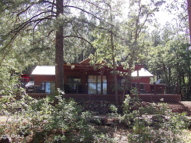 1734 Willow Mountain Rd Unit 1, Happy Jack, AZ 86024 - back of house featuring covered porch and a metal roof