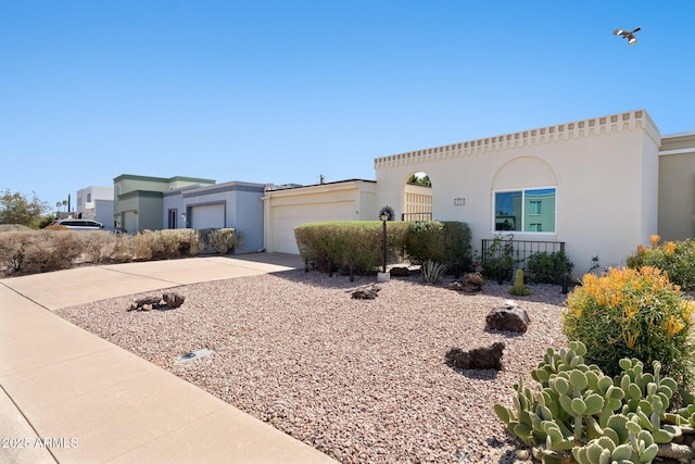 mediterranean / spanish house with stucco siding and driveway