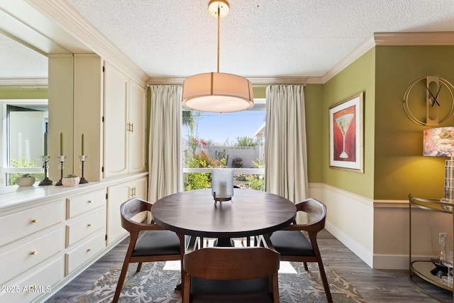 dining area with crown molding, dark wood-style floors, baseboards, and a textured ceiling