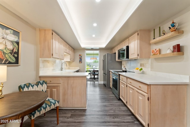 kitchen with light brown cabinets, decorative backsplash, appliances with stainless steel finishes, dark wood-style floors, and a raised ceiling