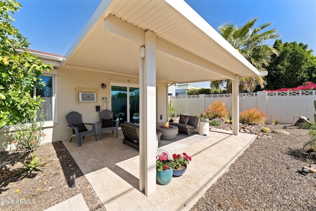 view of patio / terrace with outdoor lounge area and fence