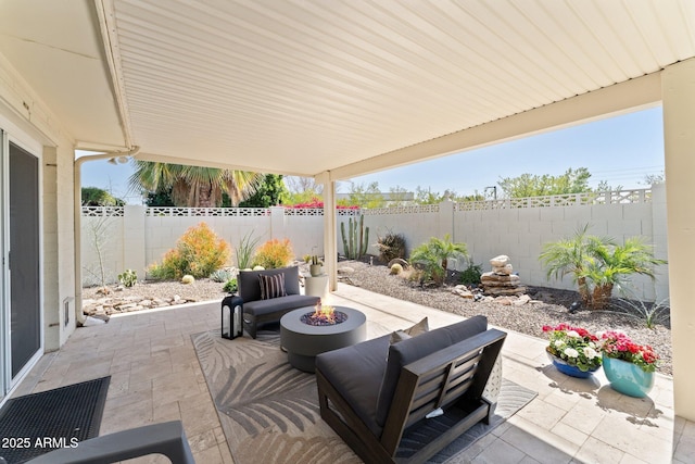 view of patio with a fire pit and a fenced backyard