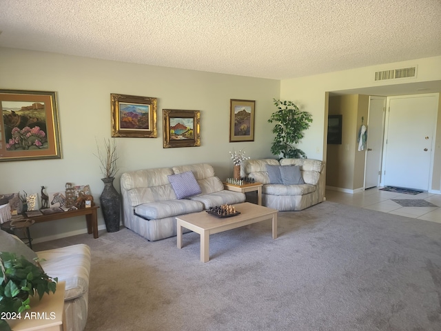 carpeted living room with a textured ceiling