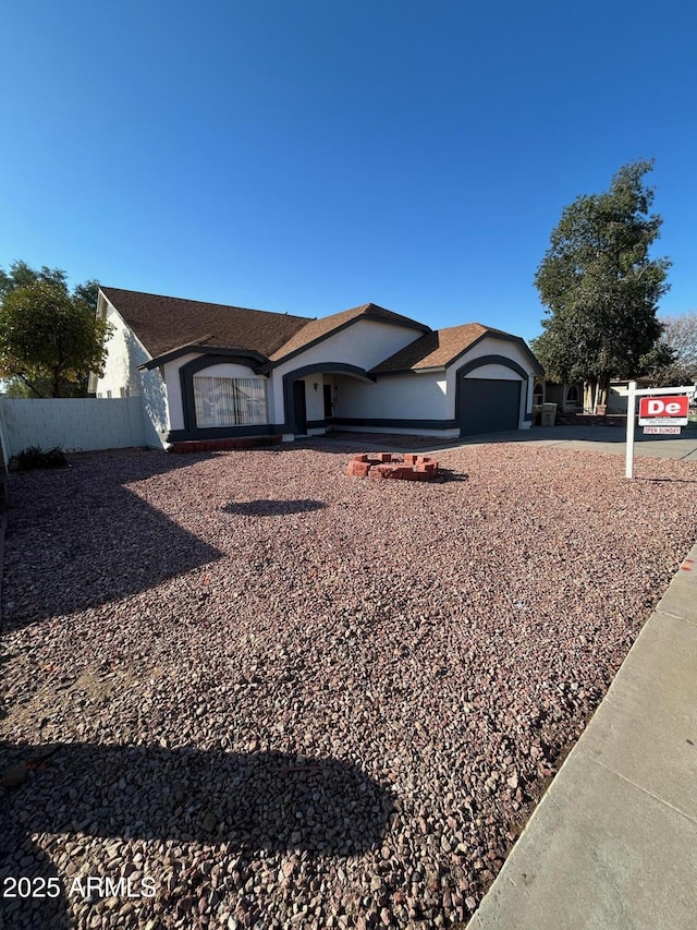 single story home with a garage