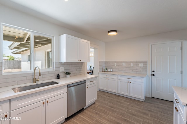 1466 E Nielson Ave, Mesa, AZ 85204 - kitchen with dishwasher, decorative backsplash, white cabinets, and light countertops