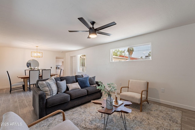 1466 E Nielson Ave, Mesa, AZ 85204 - living area with a chandelier, wood finished floors, and a ceiling fan