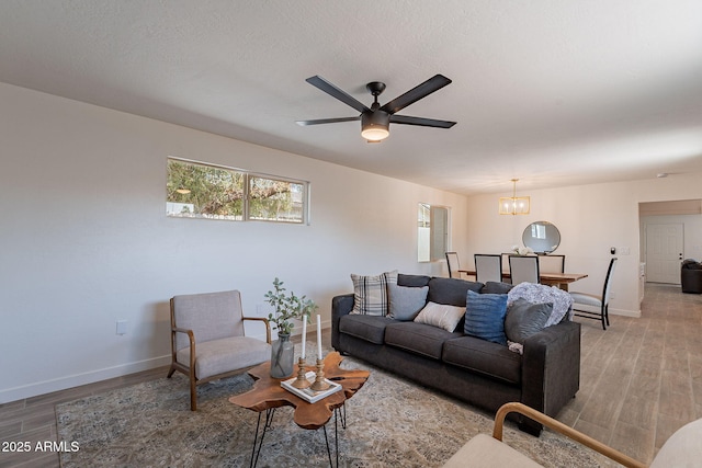 1466 E Nielson Ave, Mesa, AZ 85204 - living room with light wood-type flooring, a chandelier, and a ceiling fan