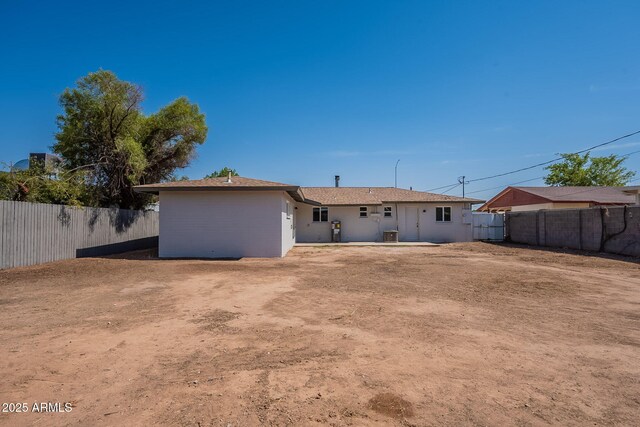 1466 E Nielson Ave, Mesa, AZ 85204 - rear view of house with a fenced backyard and stucco siding