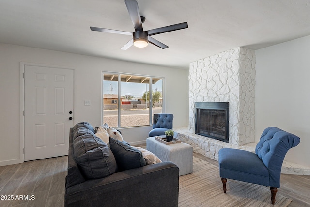1466 E Nielson Ave, Mesa, AZ 85204 - living area featuring a fireplace, wood finished floors, and a ceiling fan