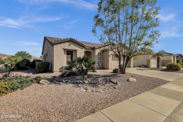 4293 E Sourwood Dr, Gilbert, AZ 85298 - mediterranean / spanish-style home with concrete driveway, stucco siding, an attached garage, and a tiled roof