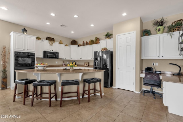 4293 E Sourwood Dr, Gilbert, AZ 85298 - kitchen featuring black appliances, a sink, recessed lighting, white cabinetry, and an island with sink