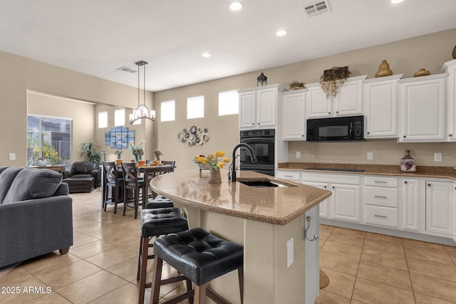 4293 E Sourwood Dr, Gilbert, AZ 85298 - kitchen featuring a sink, black appliances, open floor plan, light tile patterned floors, and recessed lighting