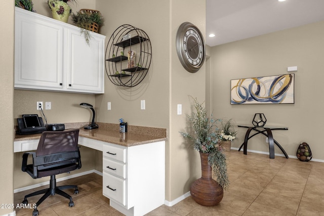 4293 E Sourwood Dr, Gilbert, AZ 85298 - office featuring built in desk, light tile patterned floors, recessed lighting, and baseboards