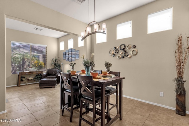 4293 E Sourwood Dr, Gilbert, AZ 85298 - dining space featuring light tile patterned floors, a chandelier, and baseboards