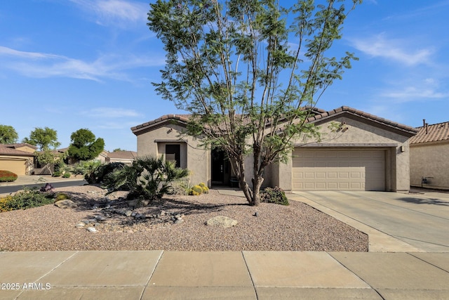 4293 E Sourwood Dr, Gilbert, AZ 85298 - view of front facade with a tile roof, stucco siding, an attached garage, and driveway