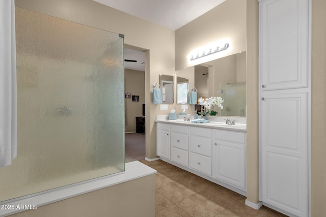4293 E Sourwood Dr, Gilbert, AZ 85298 - full bath with a stall shower, tile patterned flooring, double vanity, and baseboards