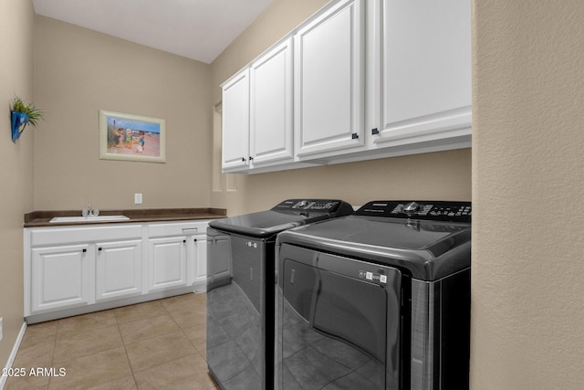 4293 E Sourwood Dr, Gilbert, AZ 85298 - laundry room with washer and dryer, cabinet space, and light tile patterned floors