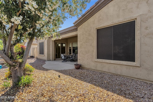 4293 E Sourwood Dr, Gilbert, AZ 85298 - rear view of house with stucco siding, a patio area, fence, and a tiled roof
