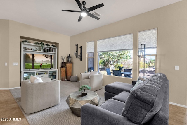 4293 E Sourwood Dr, Gilbert, AZ 85298 - living room with ceiling fan, baseboards, and light wood-style floors