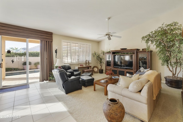 living room with ceiling fan and light tile patterned floors