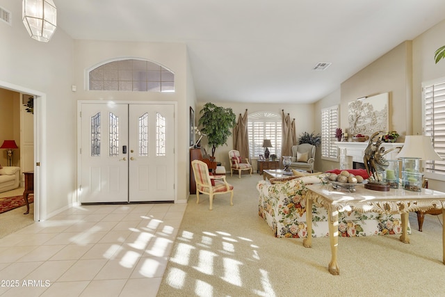 foyer entrance featuring light colored carpet