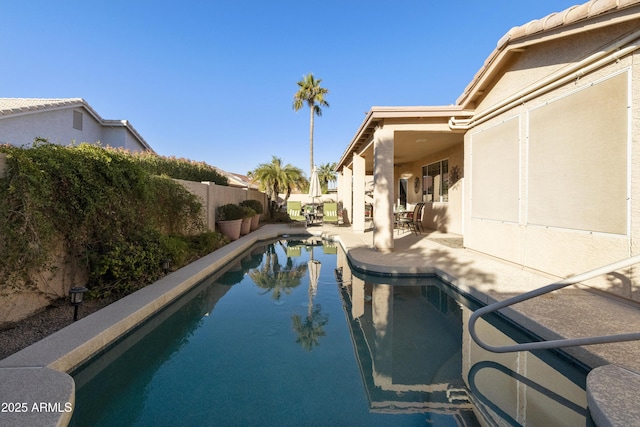 view of swimming pool with a patio