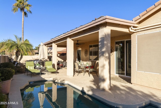 exterior space featuring a patio area and ceiling fan