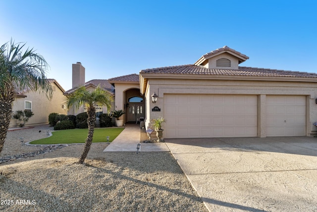 mediterranean / spanish house featuring a garage