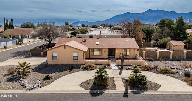 ranch-style home with a mountain view