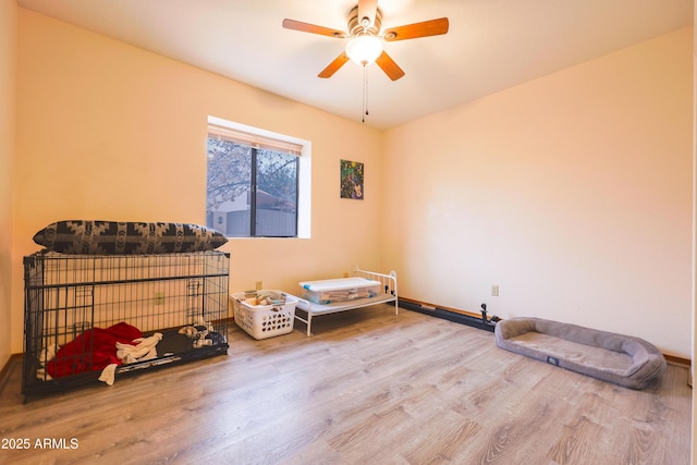 interior space with hardwood / wood-style flooring and ceiling fan