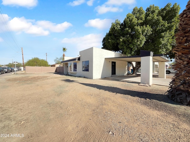 view of front of home featuring a carport