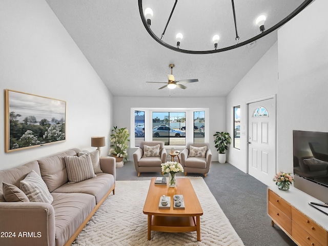 living room featuring carpet flooring, ceiling fan, high vaulted ceiling, and a textured ceiling