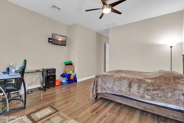 bedroom with ceiling fan and wood-type flooring