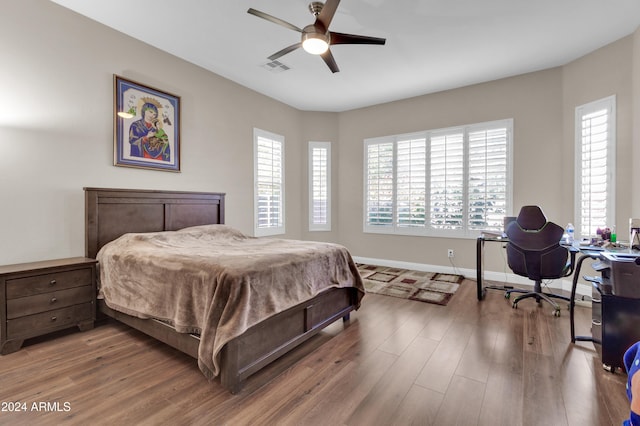 bedroom with hardwood / wood-style floors and ceiling fan