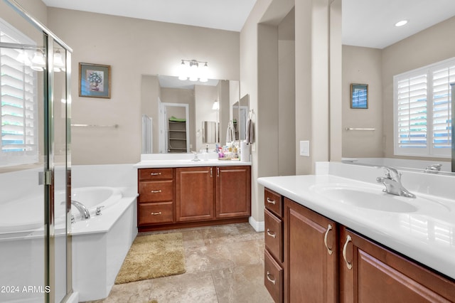 bathroom featuring vanity and plus walk in shower