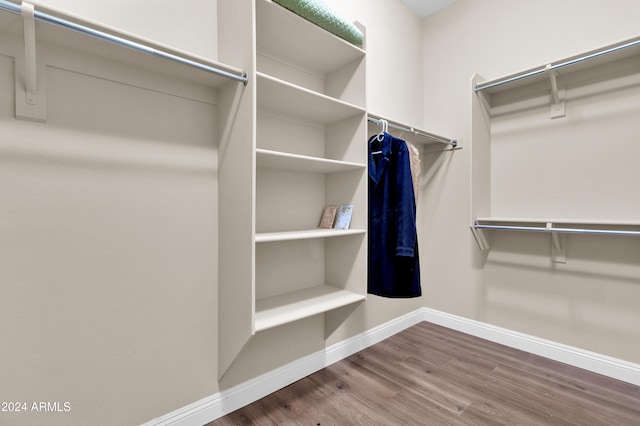 spacious closet featuring hardwood / wood-style flooring