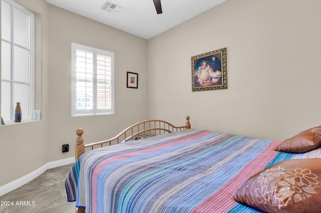 carpeted bedroom featuring ceiling fan