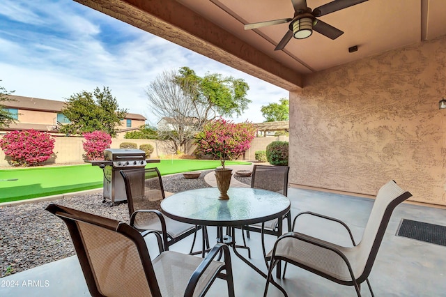 view of patio featuring a grill and ceiling fan