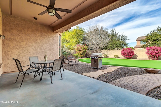 view of patio / terrace featuring ceiling fan and a grill