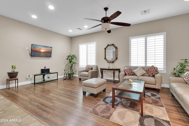 living room with ceiling fan and hardwood / wood-style floors