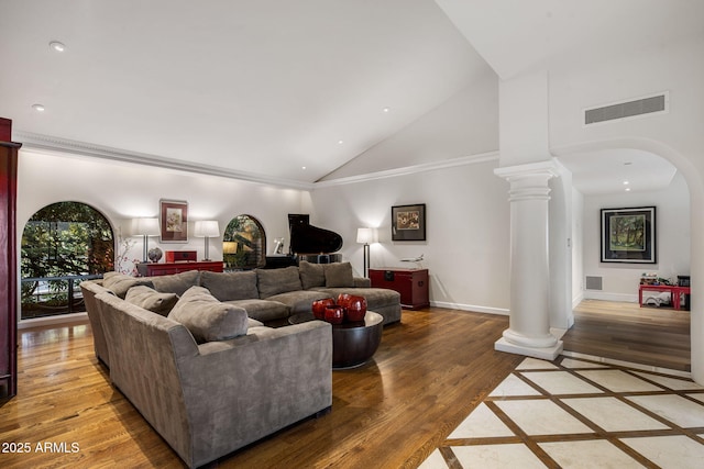 8312 N Golf Dr, Paradise Valley, AZ 85253 - living area featuring visible vents, decorative columns, wood finished floors, high vaulted ceiling, and arched walkways