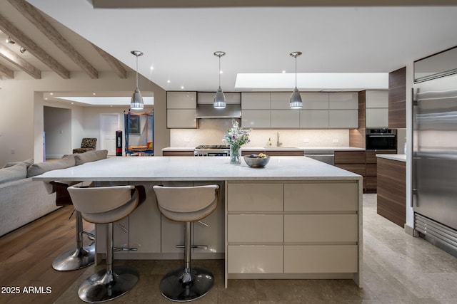 8312 N Golf Dr, Paradise Valley, AZ 85253 - kitchen featuring a sink, stainless steel appliances, open floor plan, backsplash, and modern cabinets