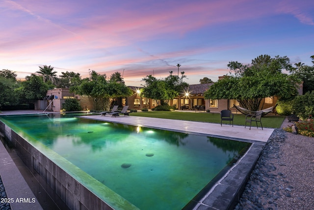 8312 N Golf Dr, Paradise Valley, AZ 85253 - view of pool with an infinity pool, a patio, and a yard