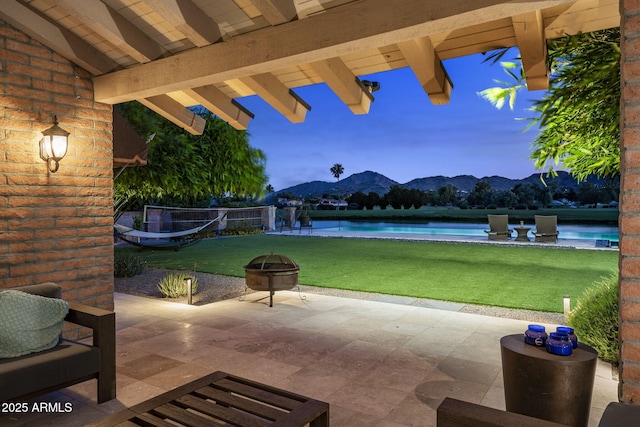 8312 N Golf Dr, Paradise Valley, AZ 85253 - view of patio / terrace featuring an outdoor fire pit, a mountain view, and an outdoor pool