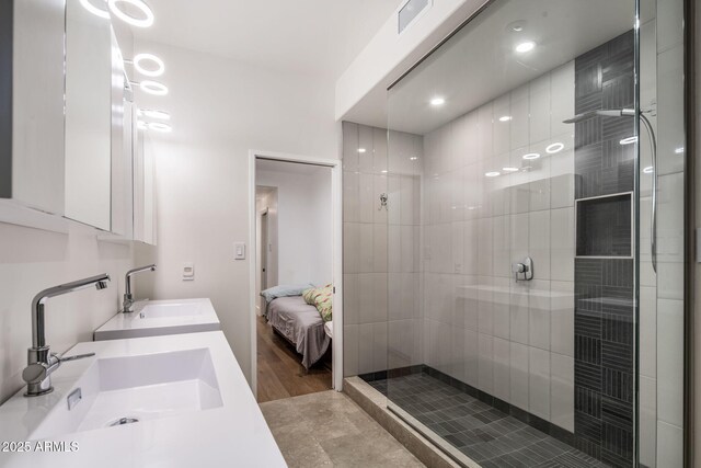 8312 N Golf Dr, Paradise Valley, AZ 85253 - ensuite bathroom featuring visible vents, a sink, ensuite bathroom, and tiled shower