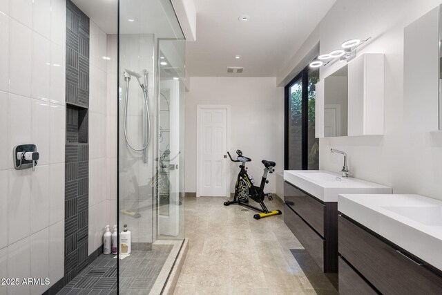 8312 N Golf Dr, Paradise Valley, AZ 85253 - bathroom featuring visible vents, baseboards, a stall shower, and two vanities
