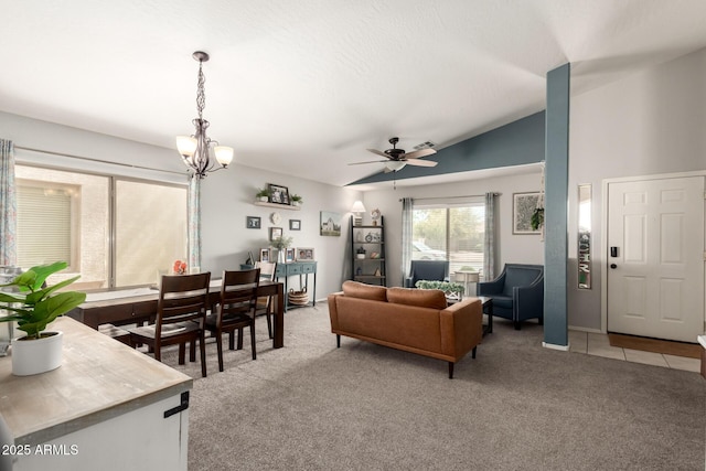 living room with light tile patterned flooring, vaulted ceiling, ceiling fan with notable chandelier, and light carpet