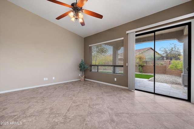 unfurnished room with lofted ceiling, plenty of natural light, and ceiling fan